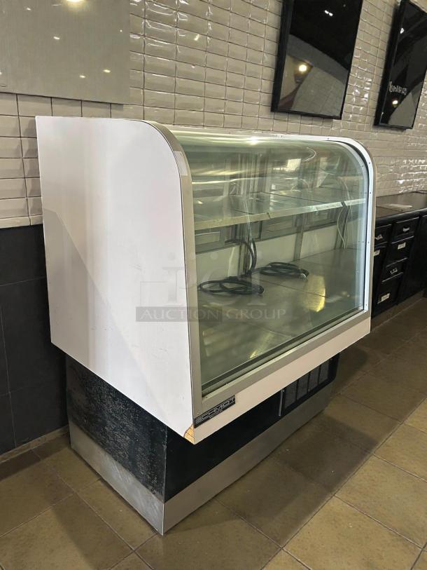 Schmidt 48” curved glass refrigerated bakery display case in great condition, tested and working, with visible logo.