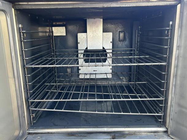 Imperial Range PCVG-1 convection oven interior, two-door model. Features steel racks, tested and working condition.