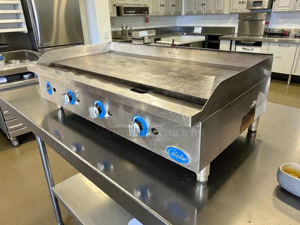 Globe GG48G 48" natural gas griddle with manual controls, stainless steel, tested working, in good condition.