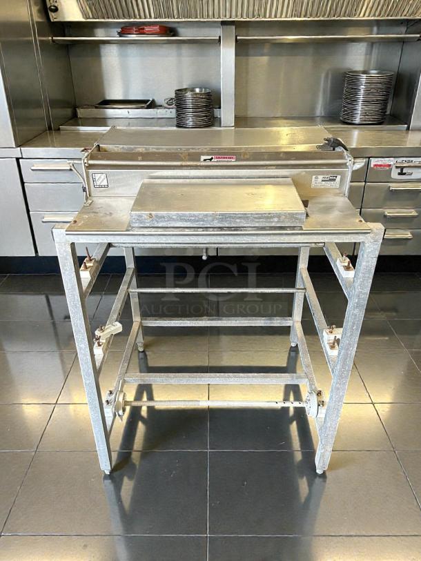 Heat Seal 104A Triple 20" Roll Film Floor Wrapping Machine in stainless steel. Tested and working condition. Visible brand label.