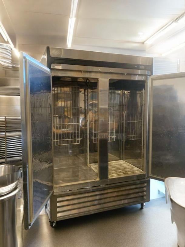 Turbo Air R49-S commercial refrigerator, stainless steel, doors open. Superb condition, 115V, fully tested and working.