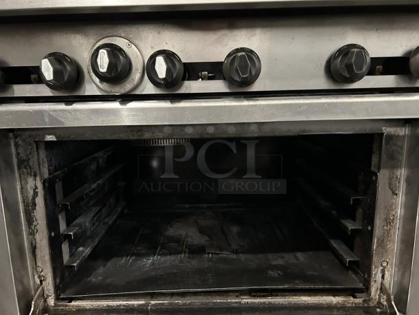 Connerton CN36-6 36" gas restaurant range in excellent condition. Features six control knobs and spacious oven interior.