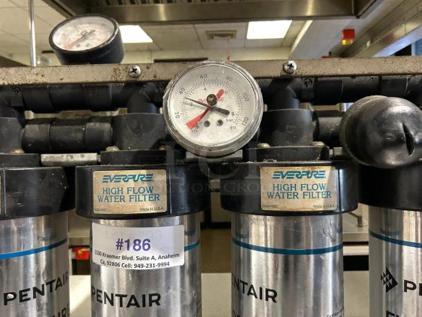 Pentair Everpure i2000 Insurice water filter in great condition. Features high flow capacity, gauge, and labeled "Made in USA."
