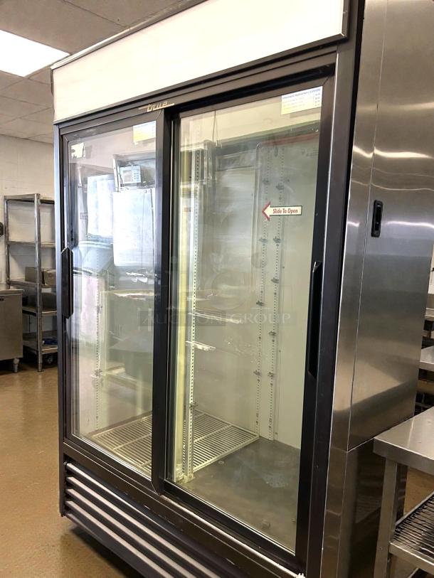 True GDM-45-HC-LD 51" glass door merchandiser, excellent condition, dual sections, tested and working, slide to open.