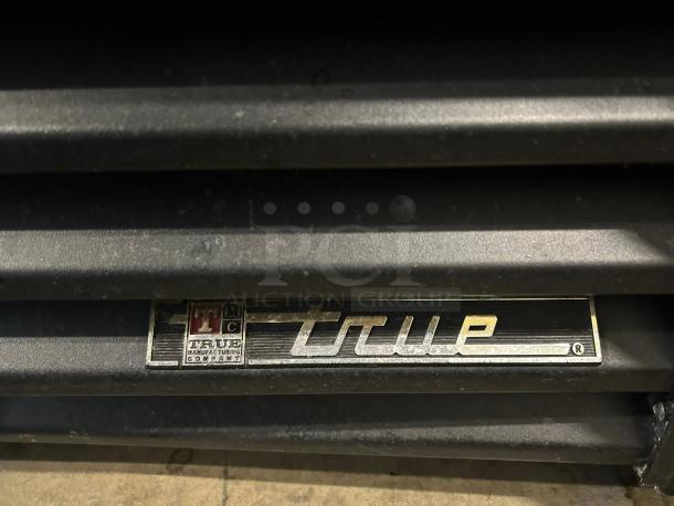 True GDM-45-HC-LD logo on a two-section glass door merchandiser, excellent condition, tested and working.