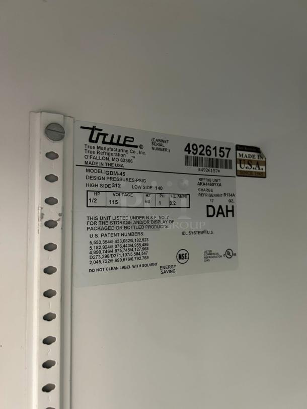 True GDM-45-HC-LD label showing model, serial number 4926157, voltage, refrigerant info, and NSF certification.