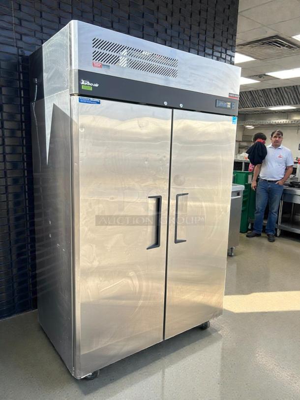 Turbo Air M3F47-2-N 52" stainless steel reach-in freezer, excellent condition, tested, dual doors, visible branding tags.