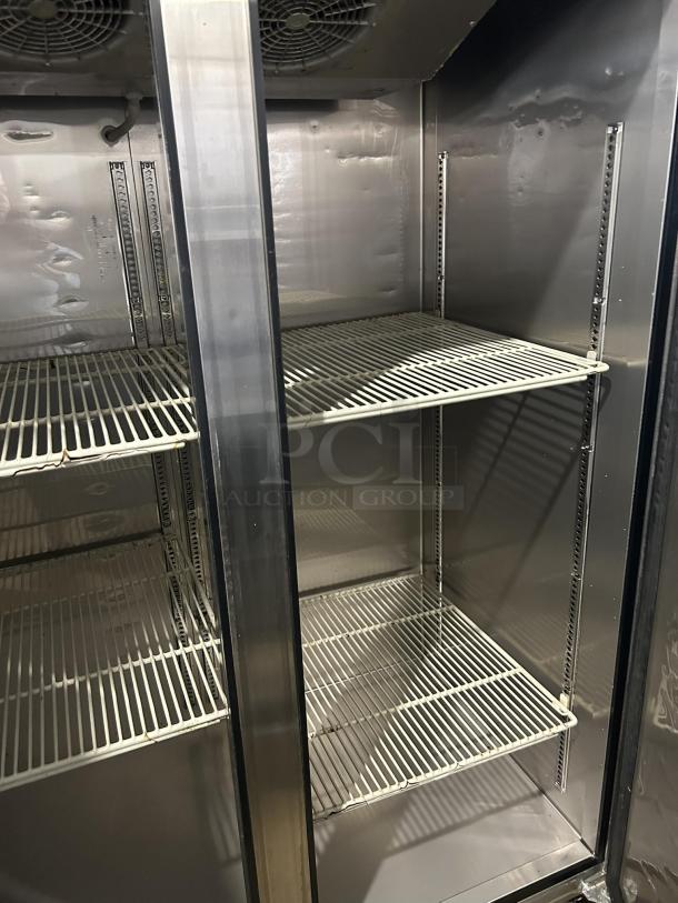 Turbo Air M3F47-2-N stainless steel reach-in freezer with adjustable shelves, interior fans, and visible shelving tracks. Tested and working.