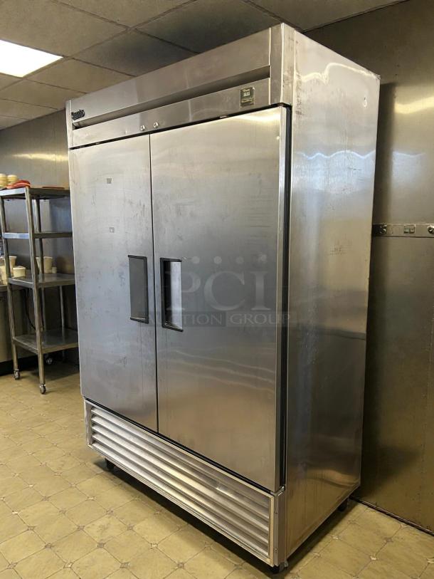 True TS-49-HC two-section reach-in refrigerator with solid doors, stainless steel finish, tested and working condition.