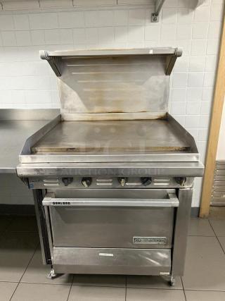 Garland G36-G36R gas range, 36" with full griddle, standard oven, natural gas, prime condition, fully tested, stainless steel.