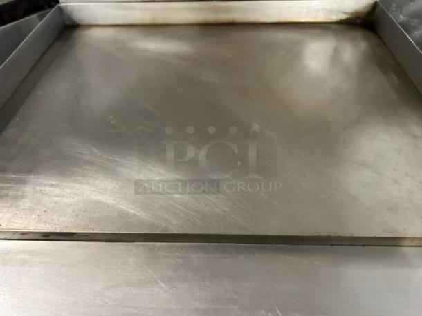 Garland G36-G36R 36" gas range with full griddle, prime condition, stainless steel, tested and working, natural gas.