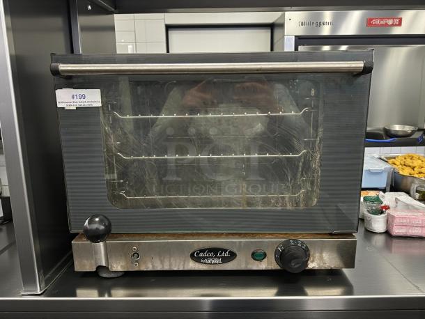 Cadco OV-013 half-size electric convection oven, manual control, tested, working, great condition, model label visible.