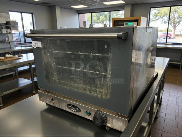 Cadco OV-013 convection oven, half-size, electric, manual controls, tested and working, great condition, model label visible.