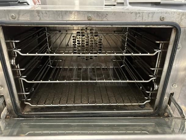 Cadco OV-013 half-size electric commercial convection oven, great condition, interior view showing racks, manual control, tested and working.