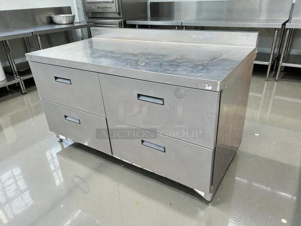 Delfield STD4464N-12 64" refrigerated sandwich prep table in excellent condition, with four drawers, stainless steel build.