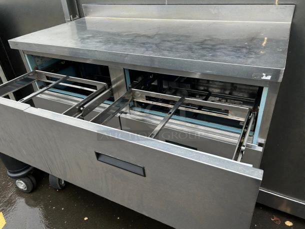 Delfield STD4464N-12 64" refrigerated prep table in excellent condition, features four drawers, stainless steel finish.