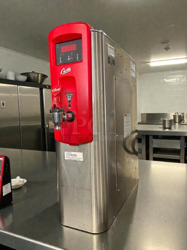 Curtis WB5N hot water dispenser in excellent condition, stainless steel, red front panel, tested and working.