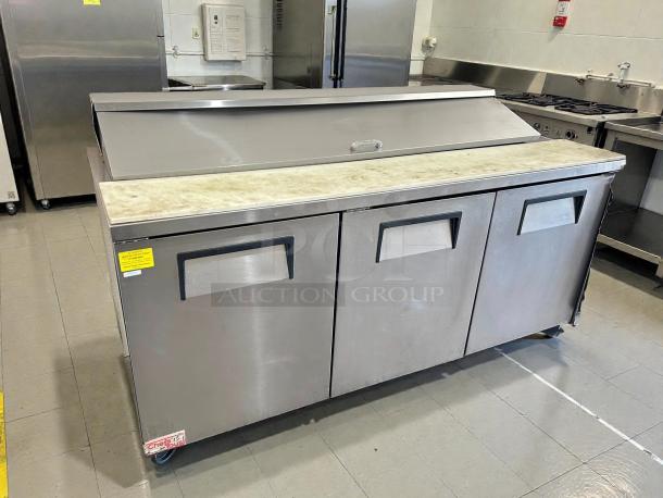 True TSSU-72-18-HC sandwich prep table; excellent condition, 72 3/8", 3 doors, stainless steel, tested and working.