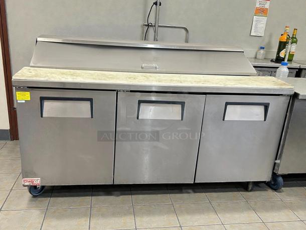 True TSSU-72-18-HC refrigerated sandwich prep table, excellent condition. Features three doors, tested and working.