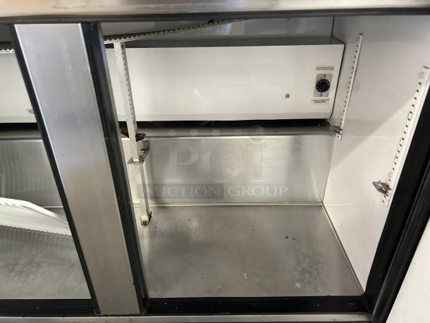 True TSSU-72-18-HC refrigerated sandwich prep table interior, excellent condition, clean stainless steel, adjustable shelf.