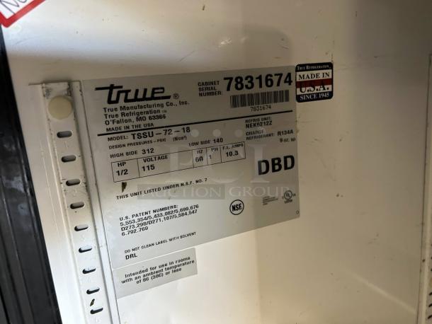 Label on True TSSU-72-18-HC sandwich prep table, showing model, serial number, design pressures, and NSF certification.