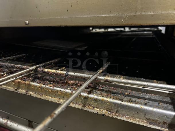 XLT 3255 Series Conveyor Oven, 32" wide, 55" long chamber, NG/LP/electric, great condition, tested, with visible cooking residue.