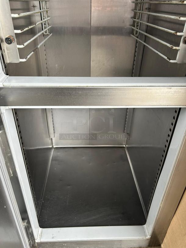 McCall 1-102001 28in Single Split Door Reach In Refrigerator, vertical view, clean interior, tested and working.
