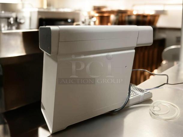 Countertop water dispenser, hot & cold unit, outstanding condition, fully tested, working, sleek modern design, visible power cords.