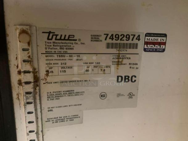 Label on True TSSU-60-16 prep table indicating model, voltage (115V), refrigerant (R134A), and manufacture in the USA.