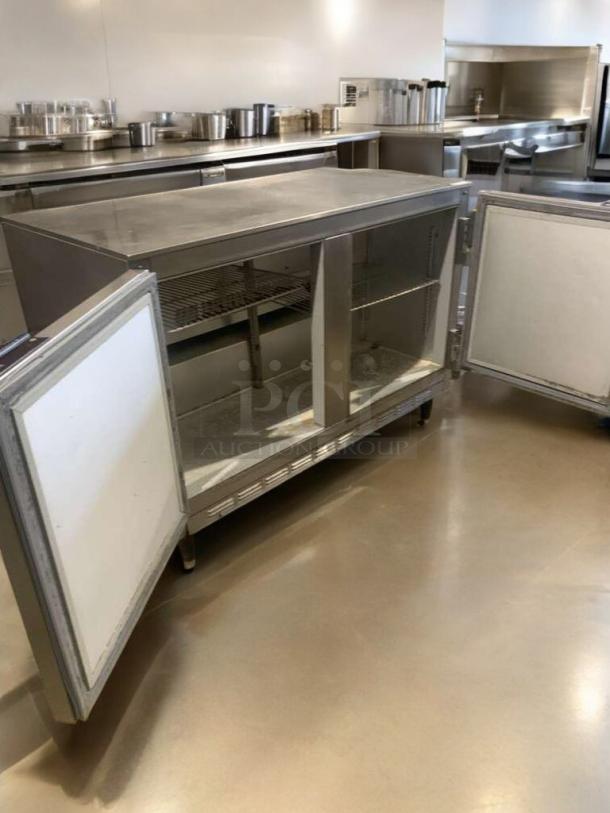 Beverage-Air UCR48 undercounter refrigerator, 115V, open double doors, prime condition, stainless steel finish, fully tested.