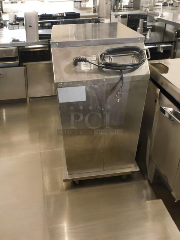 Electric WITTCO warming cabinet in great condition, stainless steel, 120V, fully tested, with visible power cord and label.