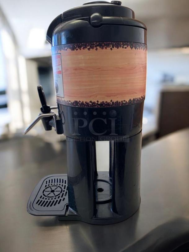The Coffee Bean & Tea Leaf commercial coffee dispenser, airpot station, great condition, brand wrap visible.