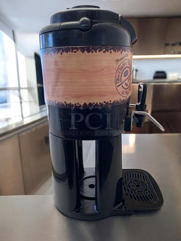 The Coffee Bean & Tea Leaf commercial coffee dispenser, black, branded wrap, great condition, tested and working.