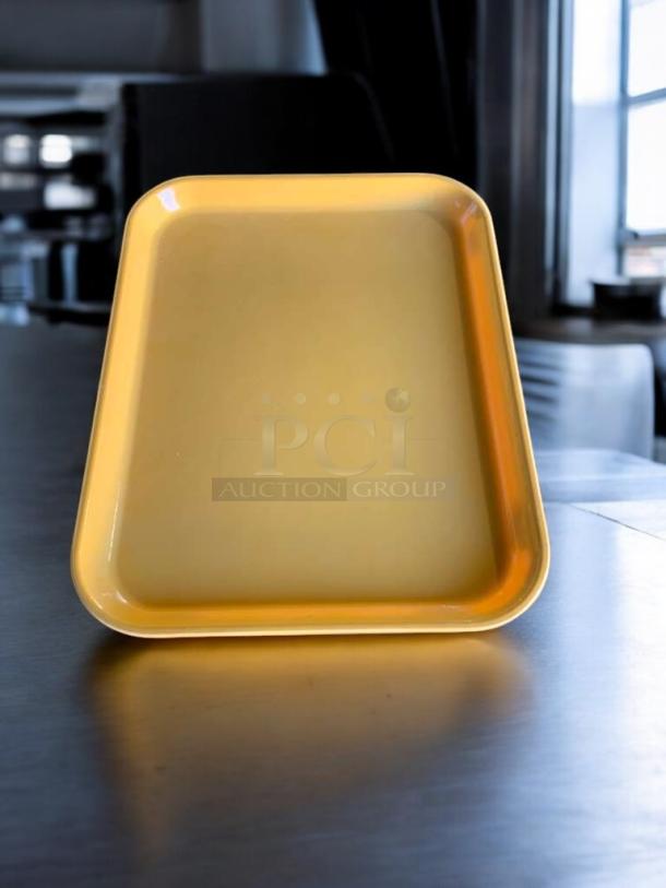 Mint condition yellow plastic serving tray, durable and lightweight, from Generic Commercial Foodservice, fully tested.