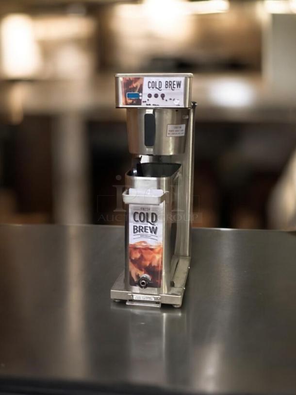 Commercial cold brew dispenser, stainless steel, great condition, fully tested, labeled "Cold Brew."