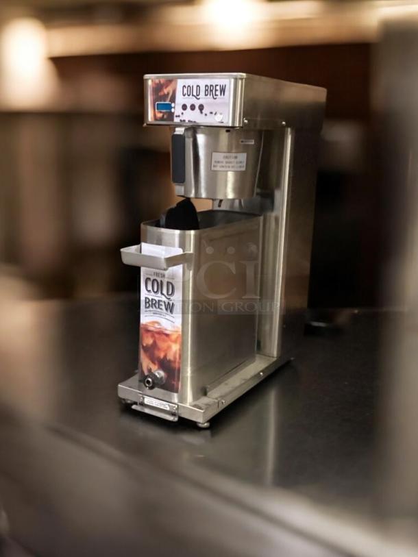Commercial cold brew dispenser, stainless steel, excellent condition, fully tested and working, labeled "Cold Brew."