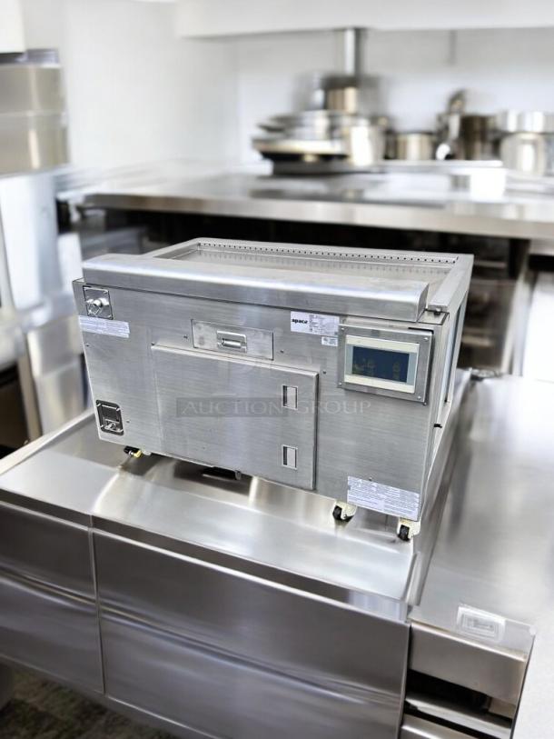 Apace UM1EGA ventless hood system, outstanding condition, 208V, stainless steel body, fully tested, commercial kitchen setting.