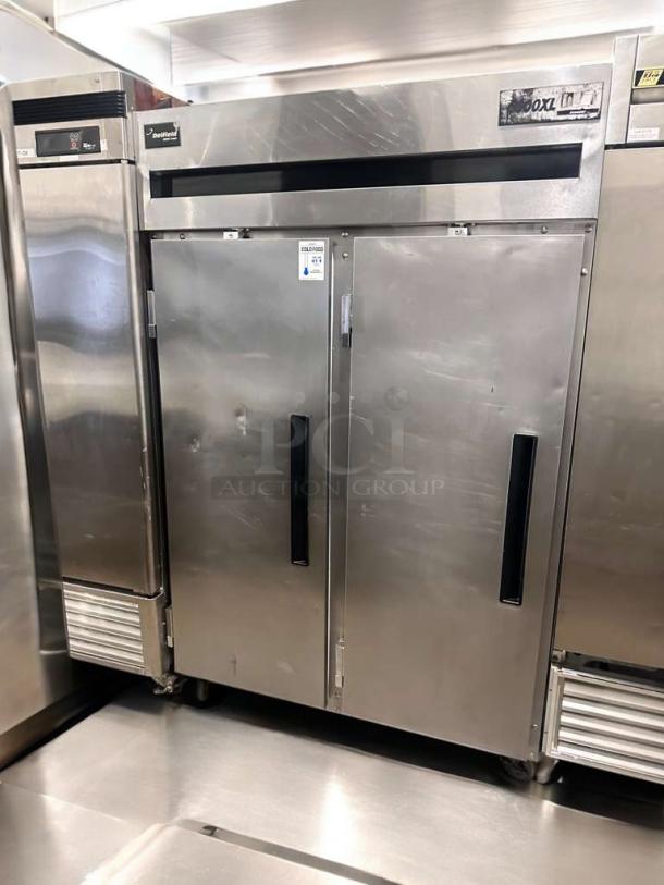 Delfield 6000XL commercial reach-in freezer, prime condition, fully tested, stainless steel, dual doors, label on top corner.
