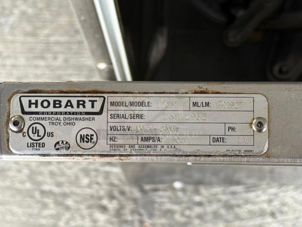 Hobart commercial dishwasher model LXPH, label visible showing serial, voltage, and certification markings.