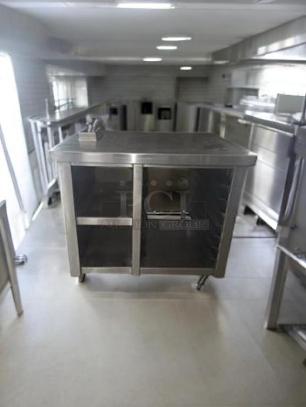 Stainless steel work table with built-in electrical outlets, commercial-grade, superb condition, fully tested, ideal for prep station.