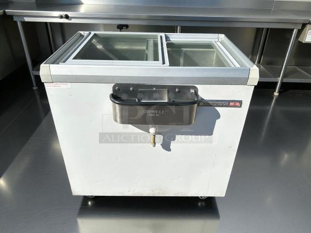 Kelvinator KCNF073WS 7 Cu.ft ice cream display freezer, excellent condition, tested, 115V, sliding glass lids, labeled.