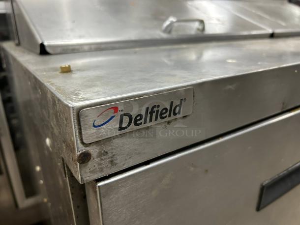 Delfield D4448NP-12 Sandwich Prep Refrigerator, 48", 12-pan top, 4 drawers, stainless steel, tested, outstanding condition.