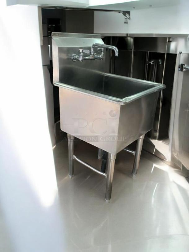 Stainless steel commercial utility sink with faucet, excellent condition, fully tested and working, by Commercial Stainless Steel Fabrication.