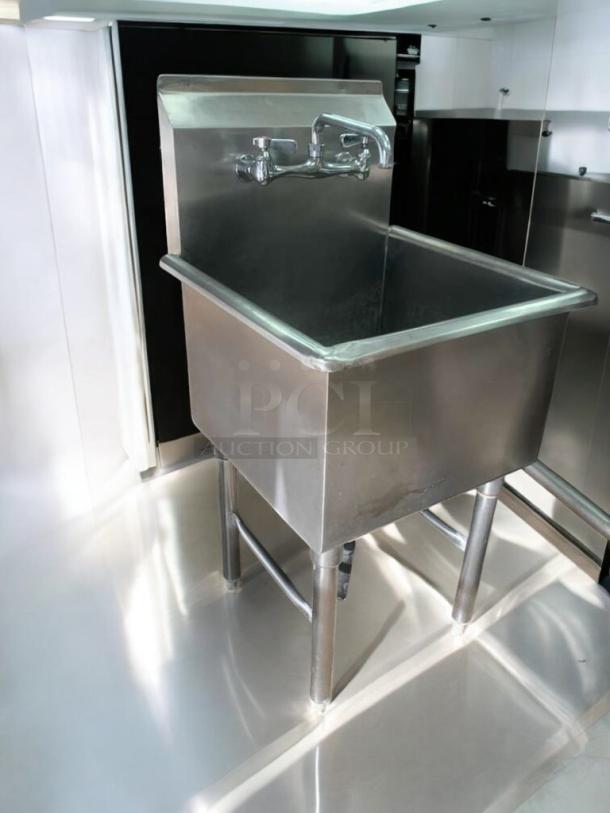 Commercial stainless steel utility sink with faucet, outstanding condition. Fully tested and working. Durable and spacious design.