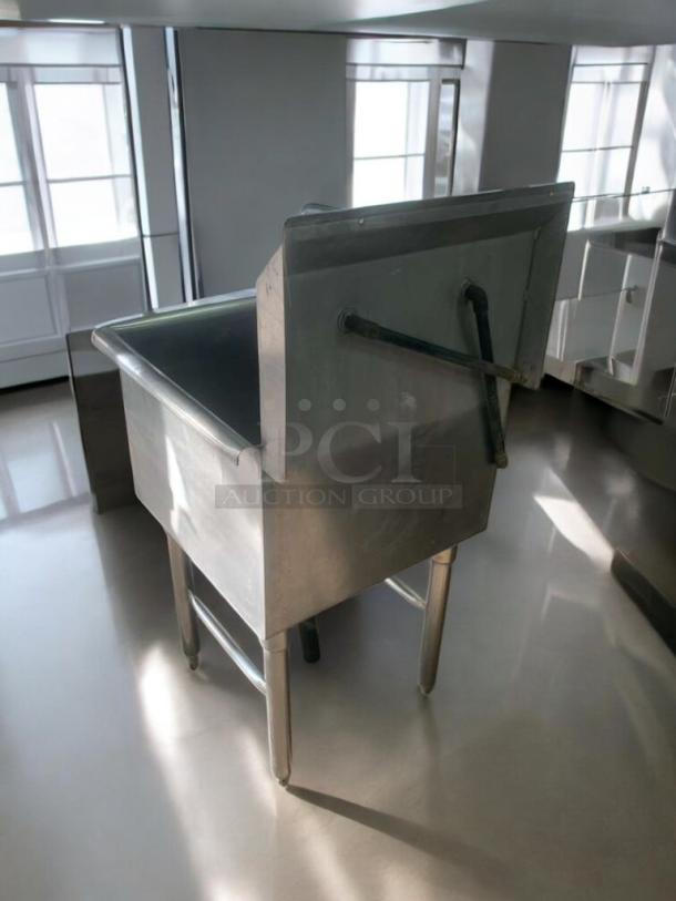 Stainless steel commercial utility sink with faucet, outstanding condition, fully tested and working. Ideal for professional use.