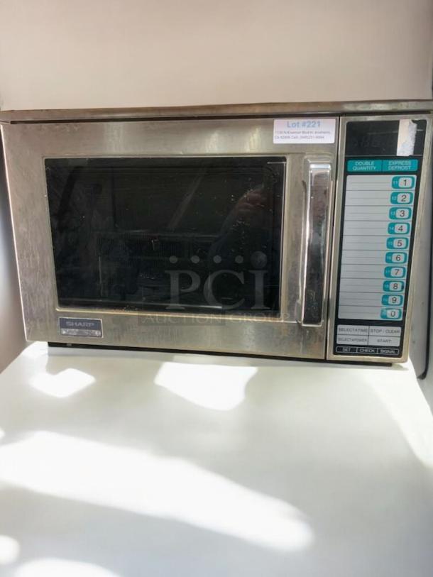 Amana RFS12MPSA commercial microwave oven, 120V, in exceptional condition, stainless steel exterior, visible control panel.
