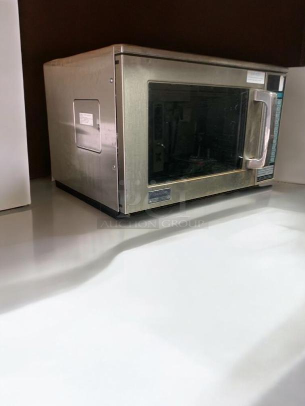Amana RFS12MPSA commercial microwave oven, stainless steel, exceptional condition, 120V, tested, with visible control panel.