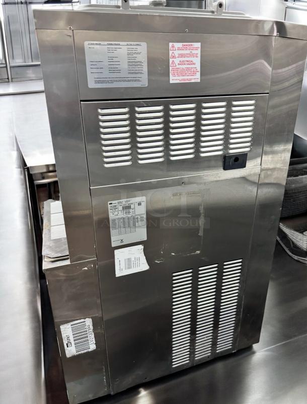 Taylor 0772 soft serve freezer in outstanding condition. Dual flavor, 208–230V, fully tested. Visible labels indicate specifications and warnings.