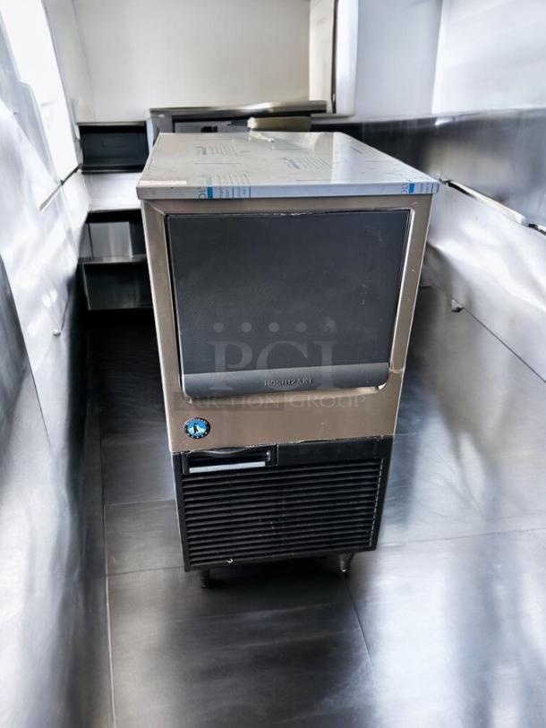 Hoshizaki KM-81BAJ undercounter crescent cube ice maker in excellent condition, 115V, fully tested and working, sleek design.