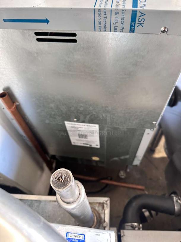 Hoshizaki KM-81BAJ ice maker, undercounter model, in exceptional condition, 115V, showing rear view and labels with specs.